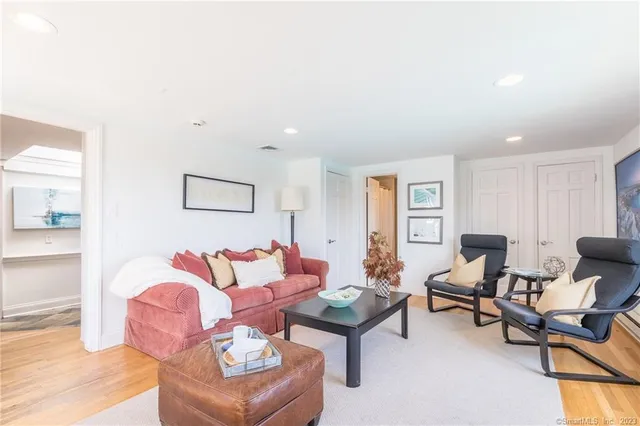 a living room with furniture and a rug