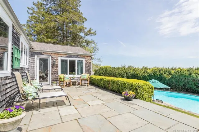 a view of a house with outdoor sitting area