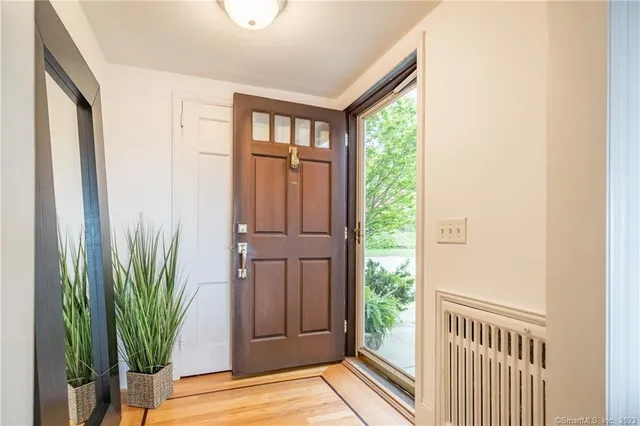 a view of front door with a potted plant