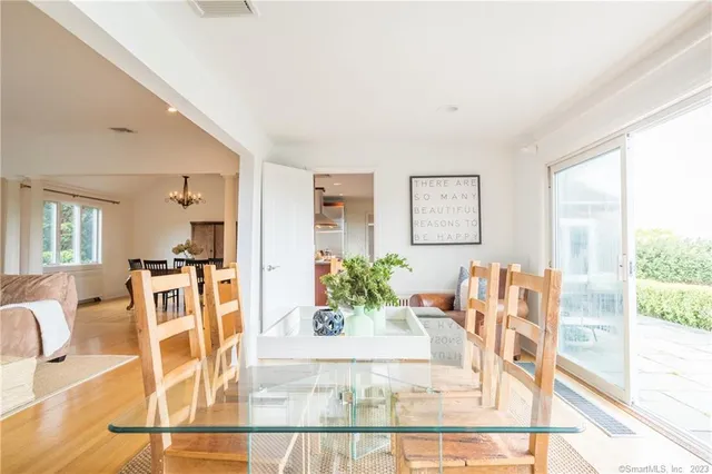 a living room with furniture and large windows