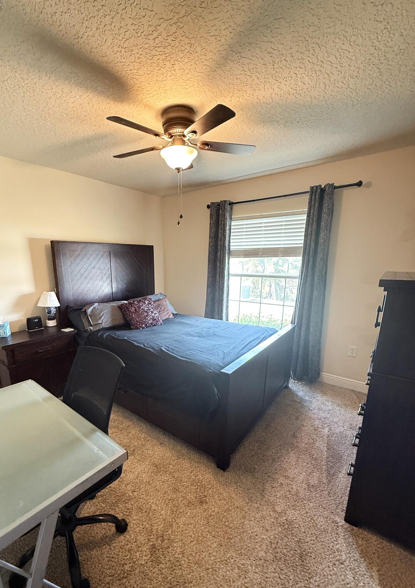 2177 Southeast Dolphin Road Port St. Lucie, FL 34952 - Photo 8 of 16 a bed room with a bed and a window