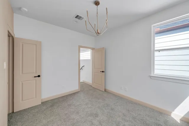 a view of empty room with windows