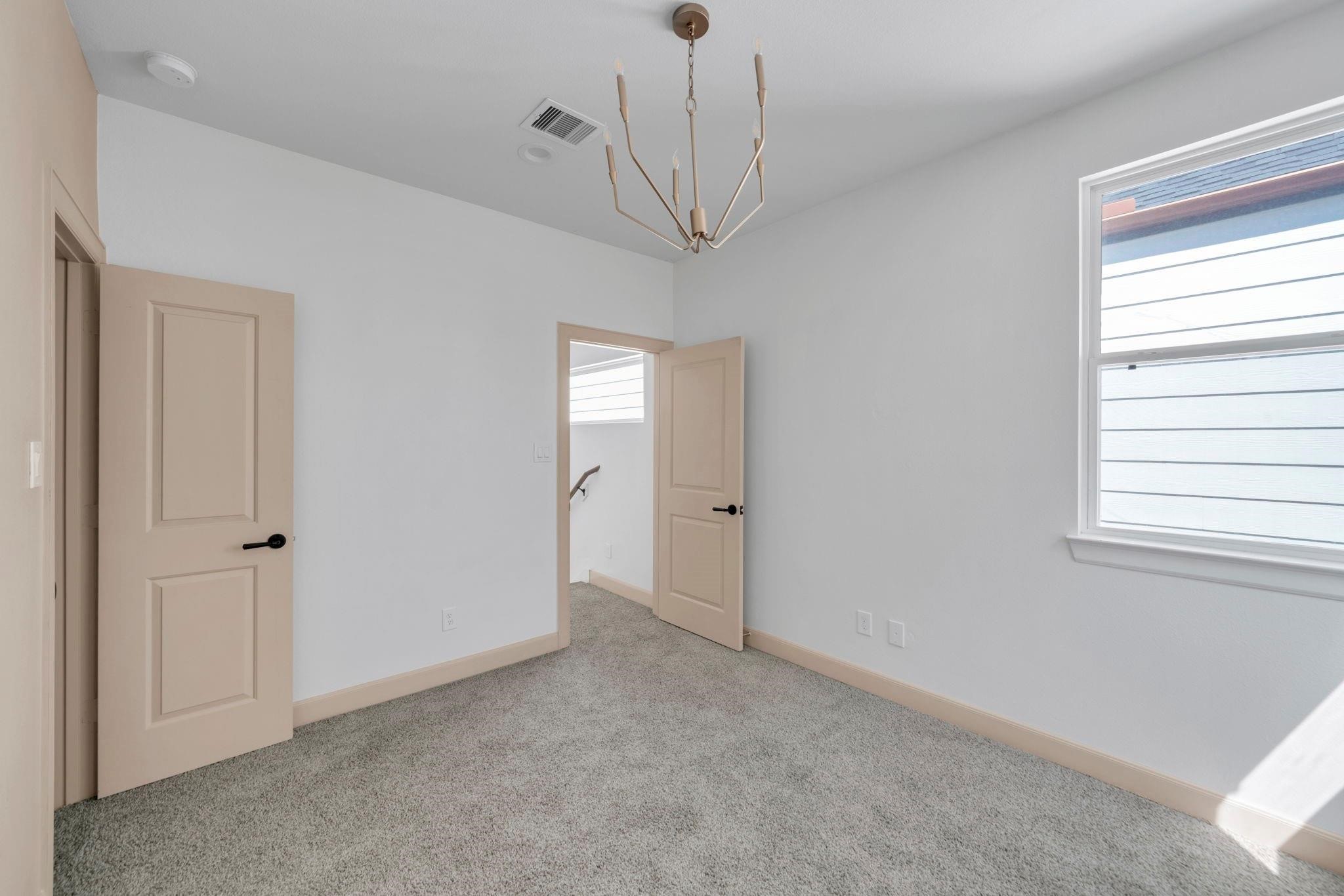 9551 Neuens Road, Unit B Houston, TX 77080 - Photo 20 of 32 a view of empty room with windows
