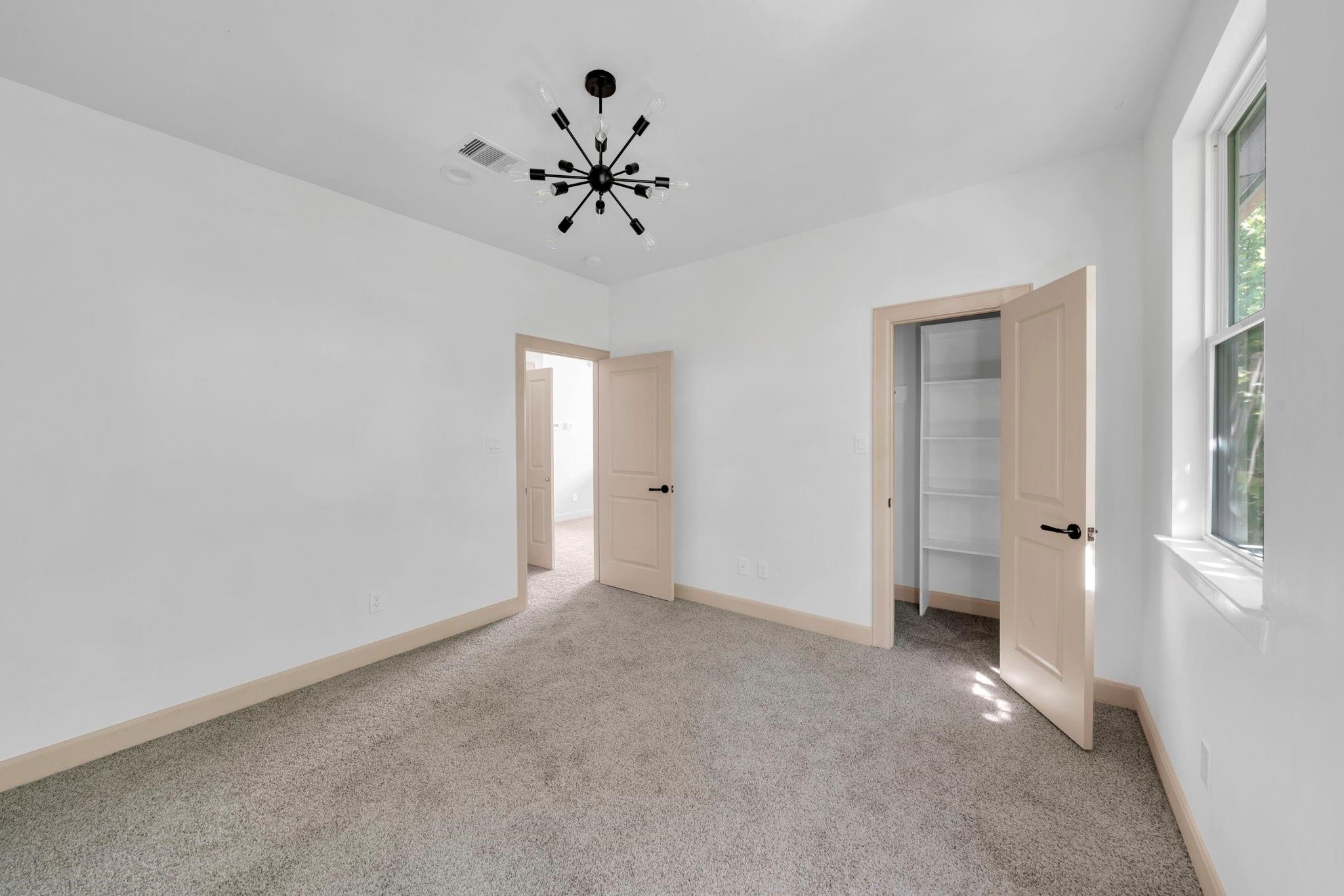 9551 Neuens Road, Unit B Houston, TX 77080 - Photo 23 of 32 a view of an empty room with a window