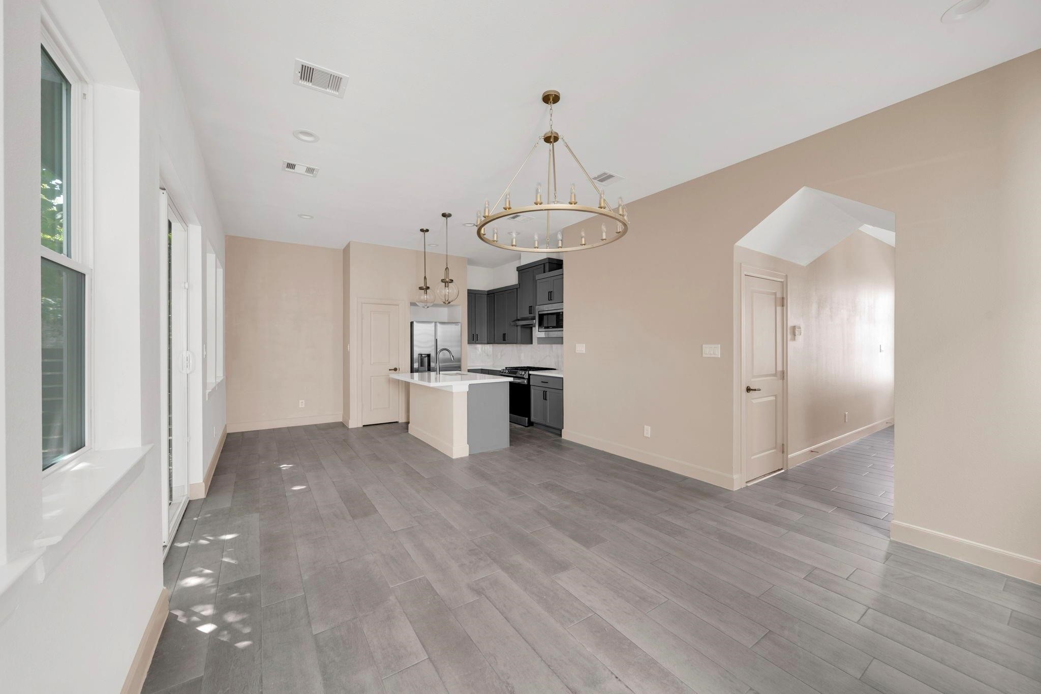9551 Neuens Road, Unit B Houston, TX 77080 - Photo 7 of 32 a view of a kitchen with wooden floor and a kitchen