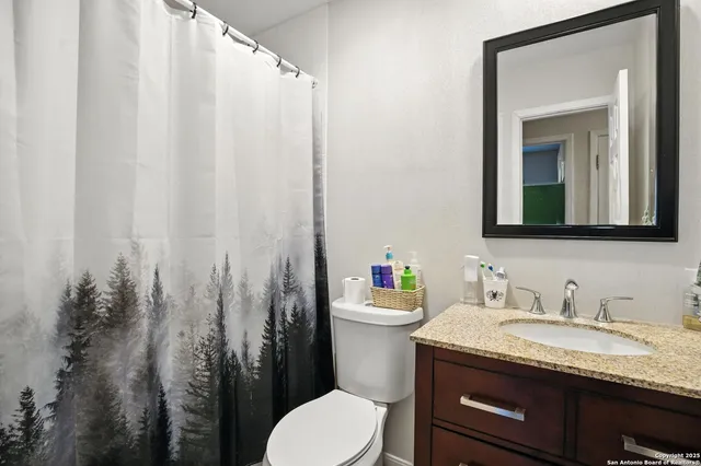 a living room with furniture floor to ceiling window and wooden floor