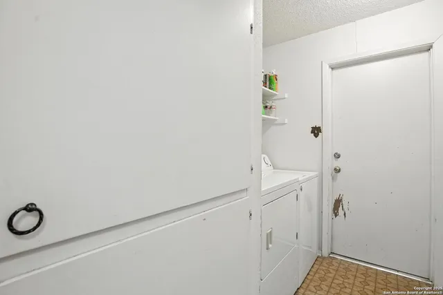 a bedroom with furniture and a chandelier
