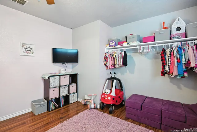 a bedroom with furniture and a chandelier