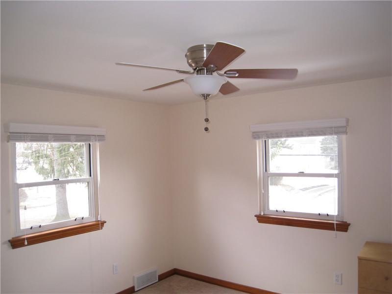 1507 Homestead Road Penn Hills, PA 15147 - Photo 11 of 17 Master Bedroom. The master bedroom features a modern ceiling fan.