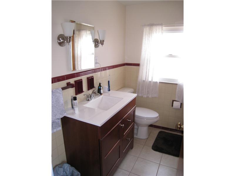 1507 Homestead Road Penn Hills, PA 15147 - Photo 13 of 17 Full Bath. The home s main bath, located on the upper level, has been updated.