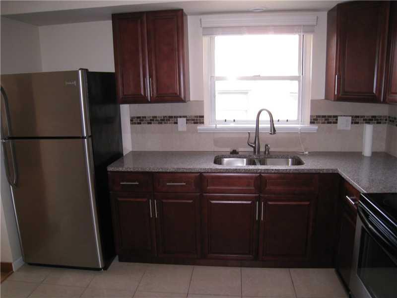1507 Homestead Road Penn Hills, PA 15147 - Photo 3 of 17 Kitchen. All kitchen appliances are included in the sale. Access to the rear patio is also offered from the kitchen.