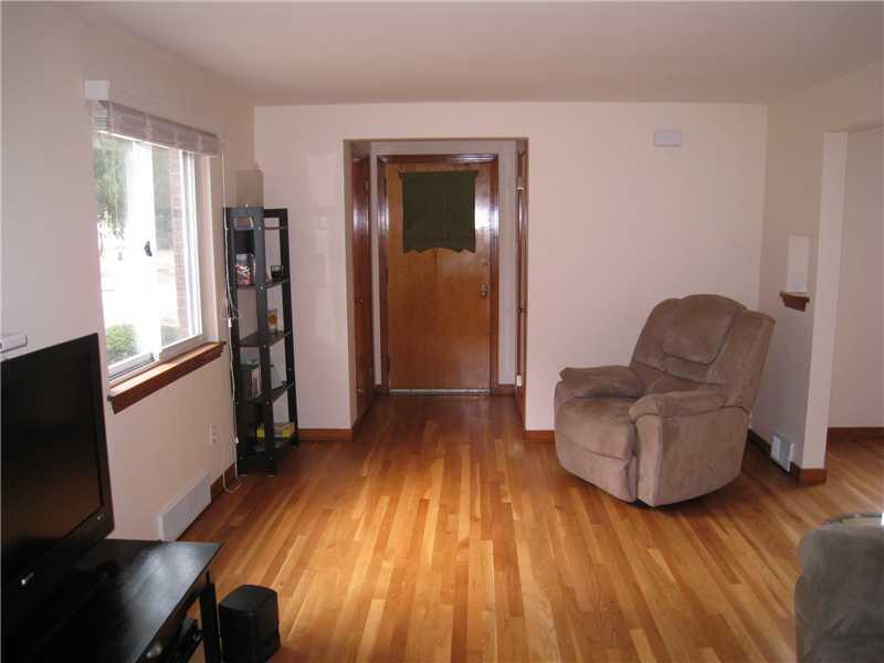 1507 Homestead Road Penn Hills, PA 15147 - Photo 5 of 17 Living Room. From the living room facing the front door. Partial bath is to the right of the front door.