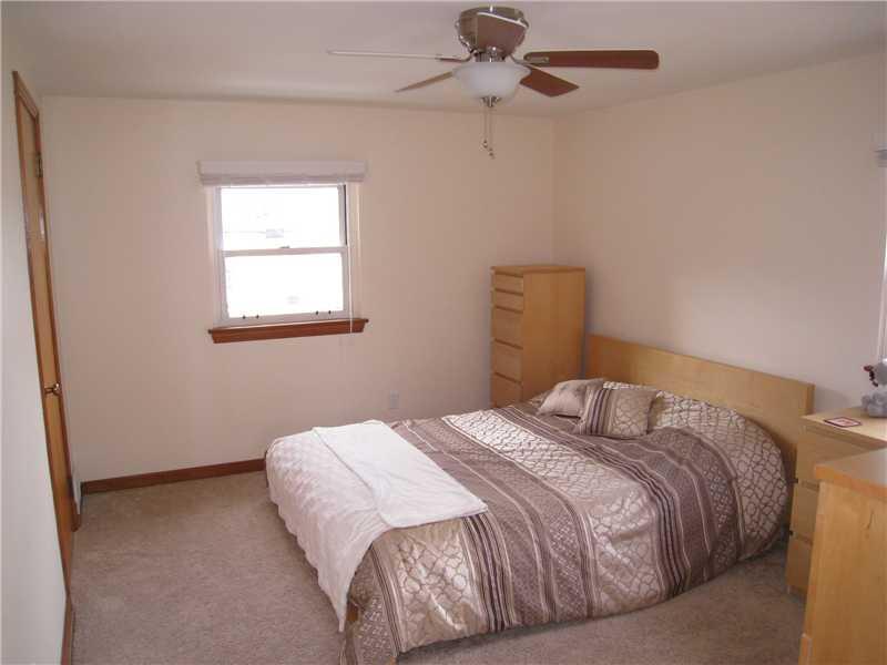 1507 Homestead Road Penn Hills, PA 15147 - Photo 9 of 17 Master Bedroom. Master bedroom features newer wall to wall carpet and modern ceiling fan.