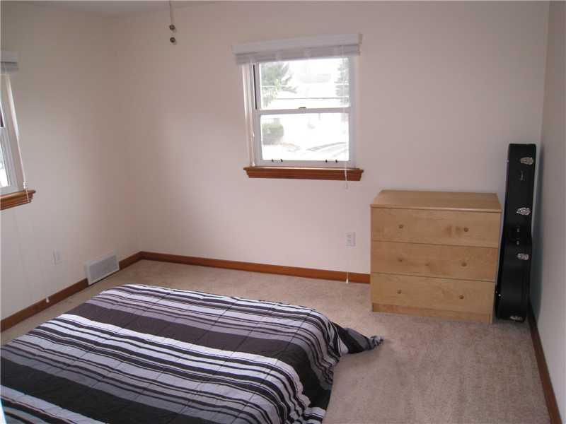 1507 Homestead Road Penn Hills, PA 15147 - Photo 10 of 17 Bedroom. Bedroom number two also features wall to wall carpet and modern ceiling fan.