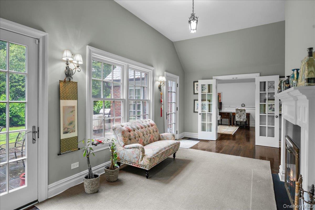 7 Harcourt Road Scarsdale, NY 10583 - Photo 14 of 34 a living room with furniture and a fireplace