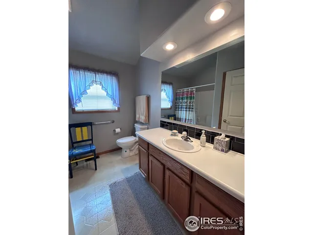 a bathroom with a sink double vanity and a mirror