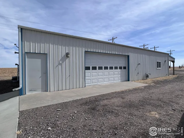 a view of a parking space in front of a house