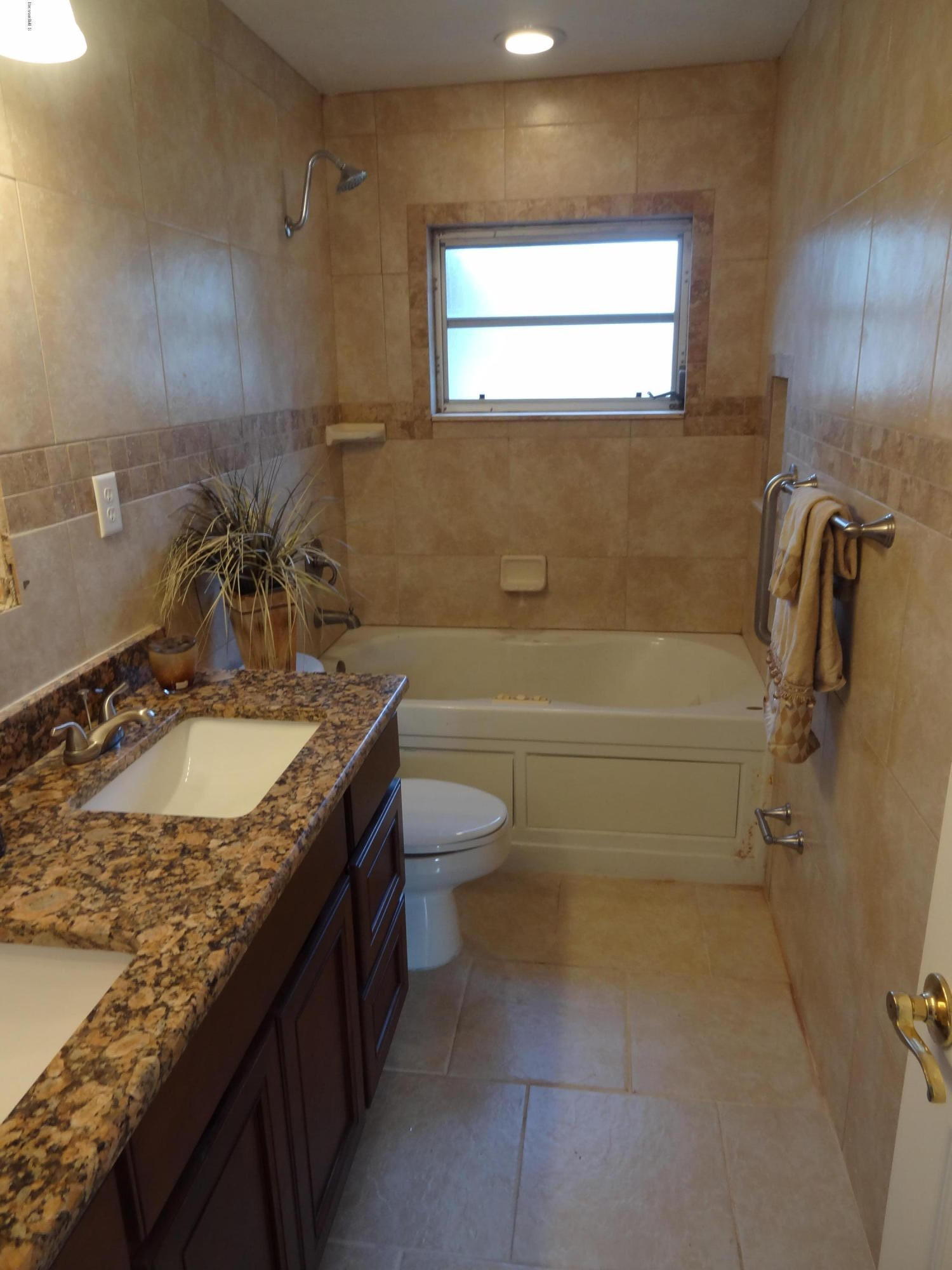 944 Kings Post Road Rockledge, FL 32955 - Photo 16 of 26 Guest Bathroom w/jacuzzi tub