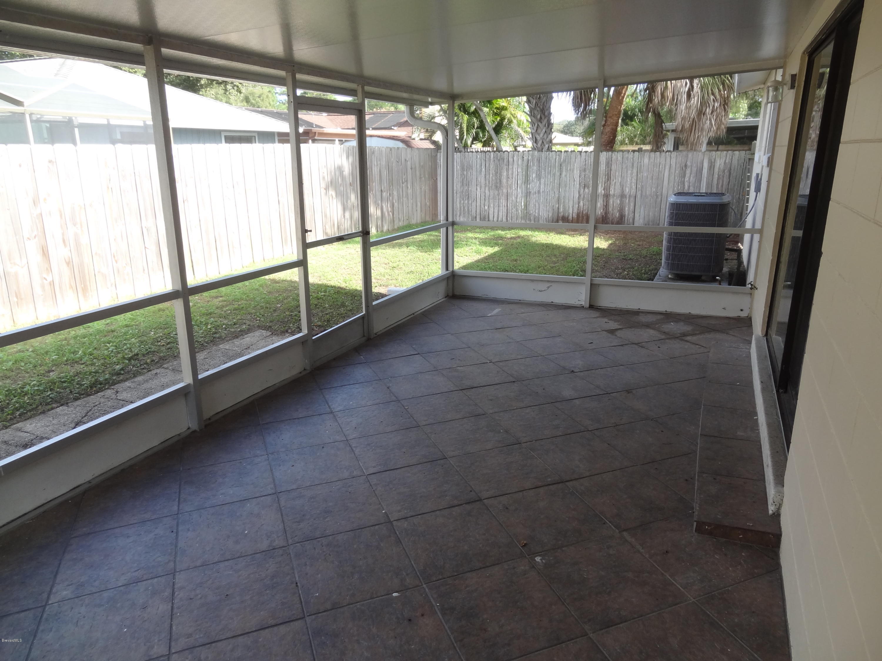 944 Kings Post Road Rockledge, FL 32955 - Photo 23 of 26 Screened Porch