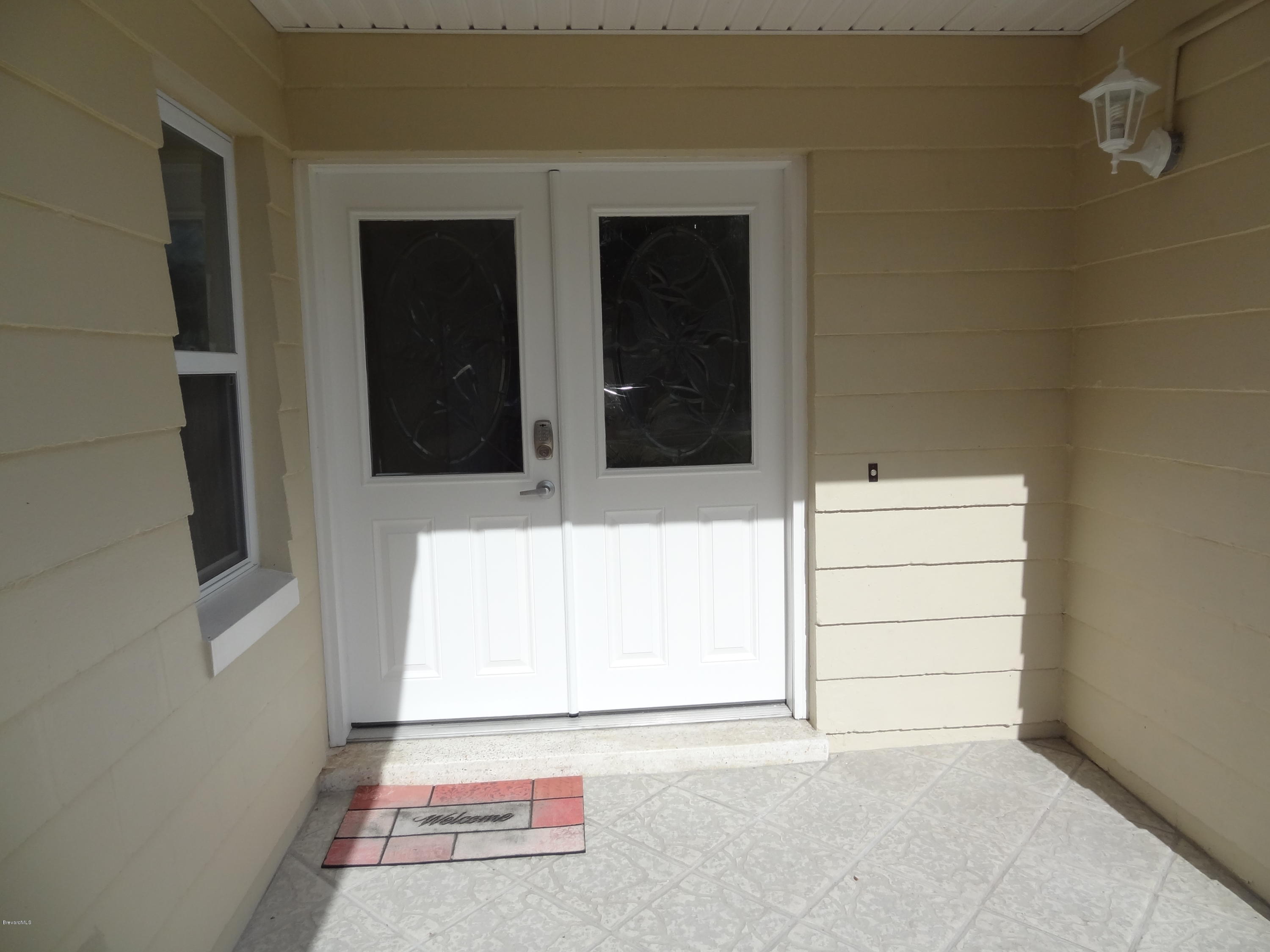 944 Kings Post Road Rockledge, FL 32955 - Photo 4 of 26 Beautiful French Front Doors