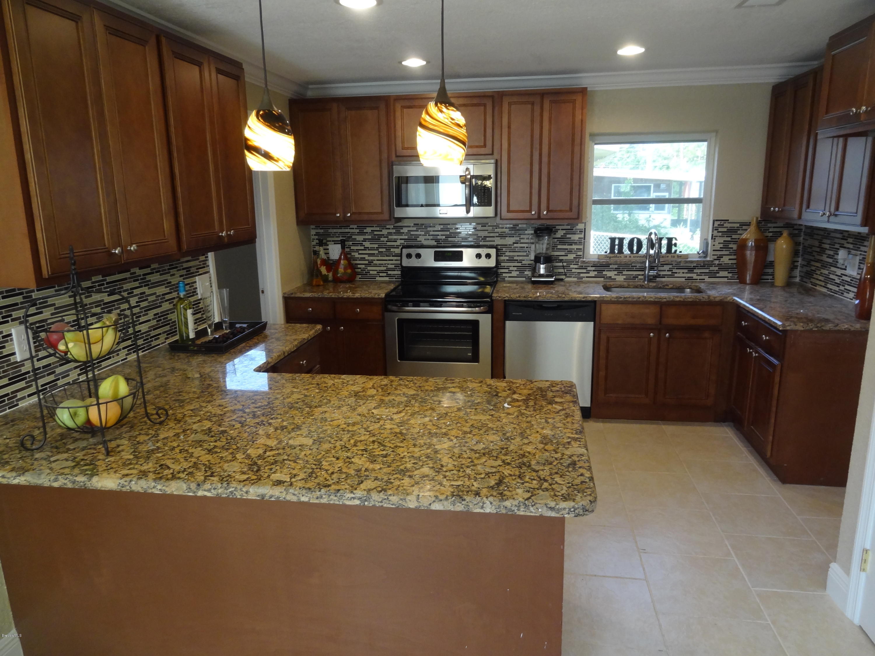 944 Kings Post Road Rockledge, FL 32955 - Photo 5 of 26 Granite and Breakfast bar