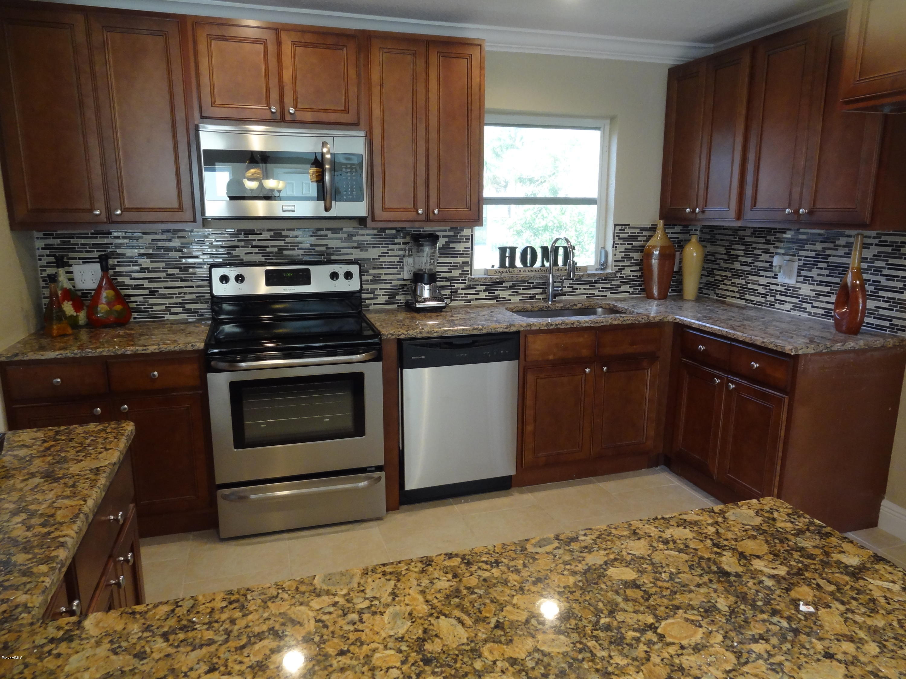 944 Kings Post Road Rockledge, FL 32955 - Photo 7 of 26 New Stainless Steel Appliances