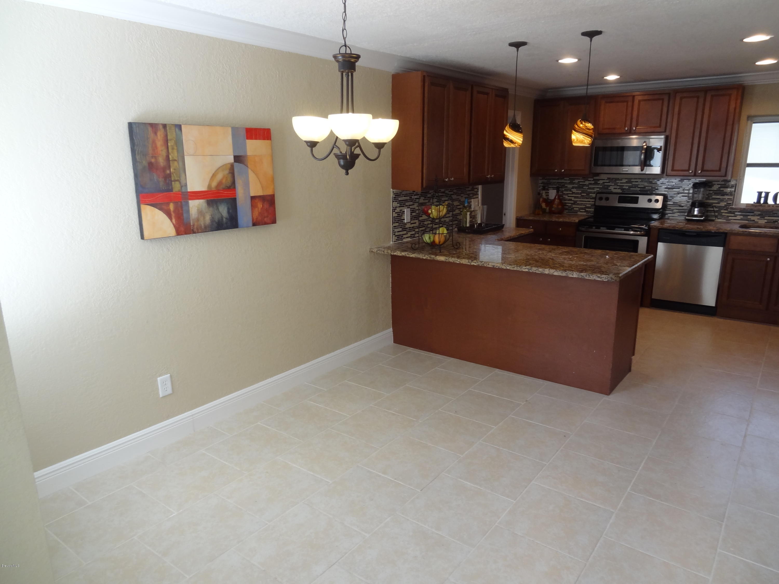 944 Kings Post Road Rockledge, FL 32955 - Photo 8 of 26 Dining Room off the kitchen