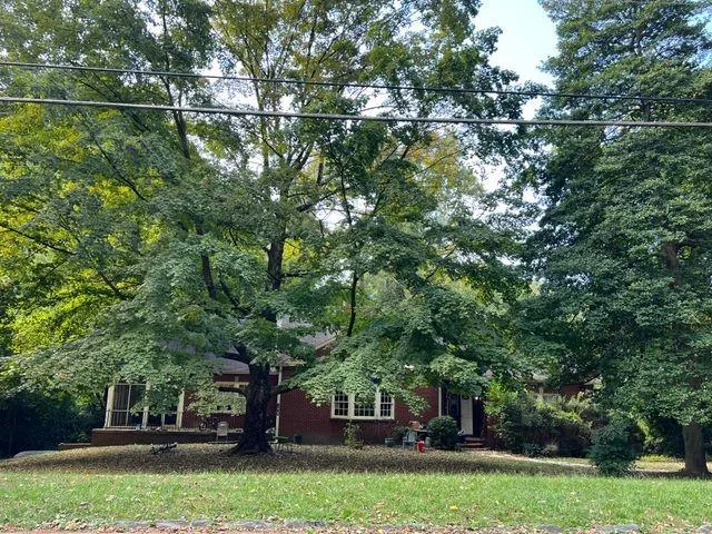 a view of a lake with a house in the background