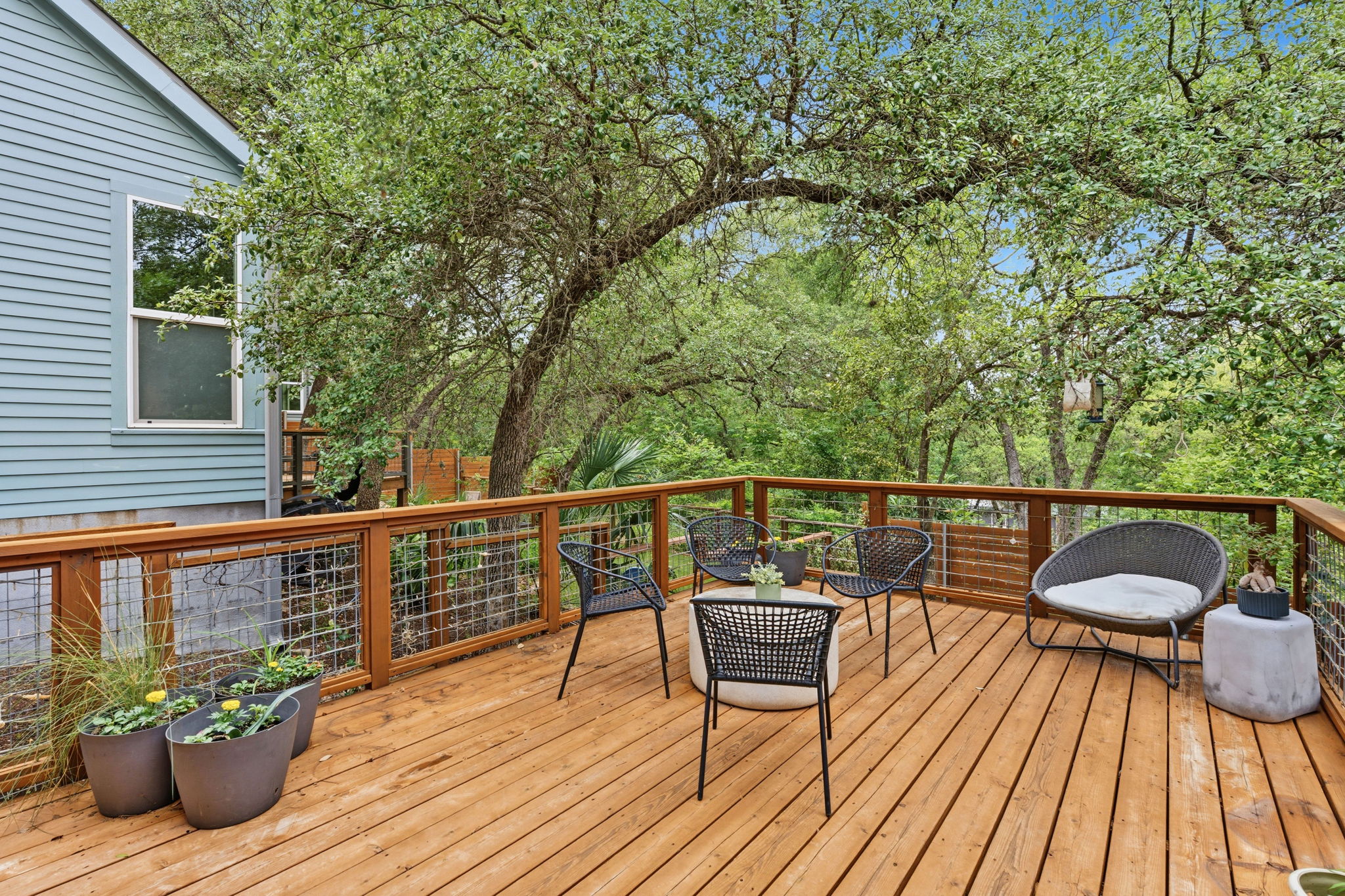 3001 Del Curto Road, Unit 31 Austin, TX 78704 - Photo 29 of 32 a view of a balcony with wooden floor and outdoor seating