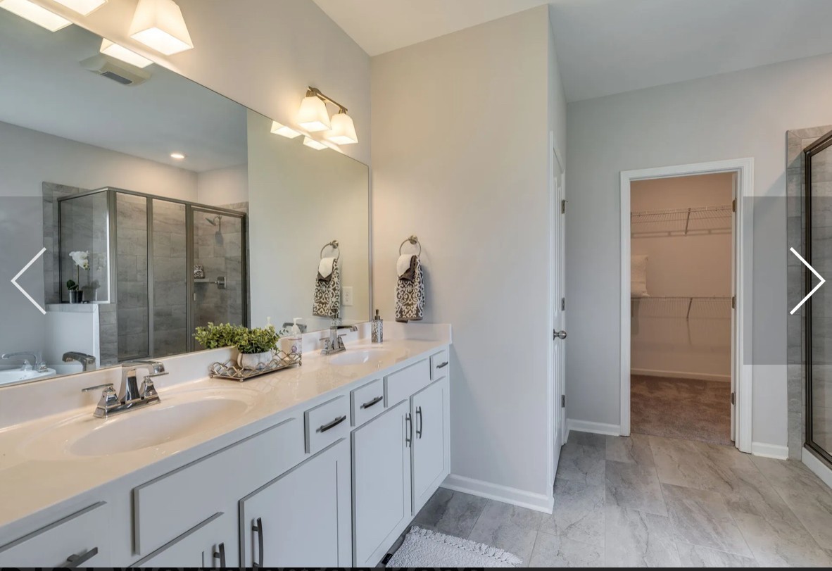 6161 Worthington Road Columbia, TN 38401 - Photo 21 of 33 a bathroom with a double vanity sink mirror and shower