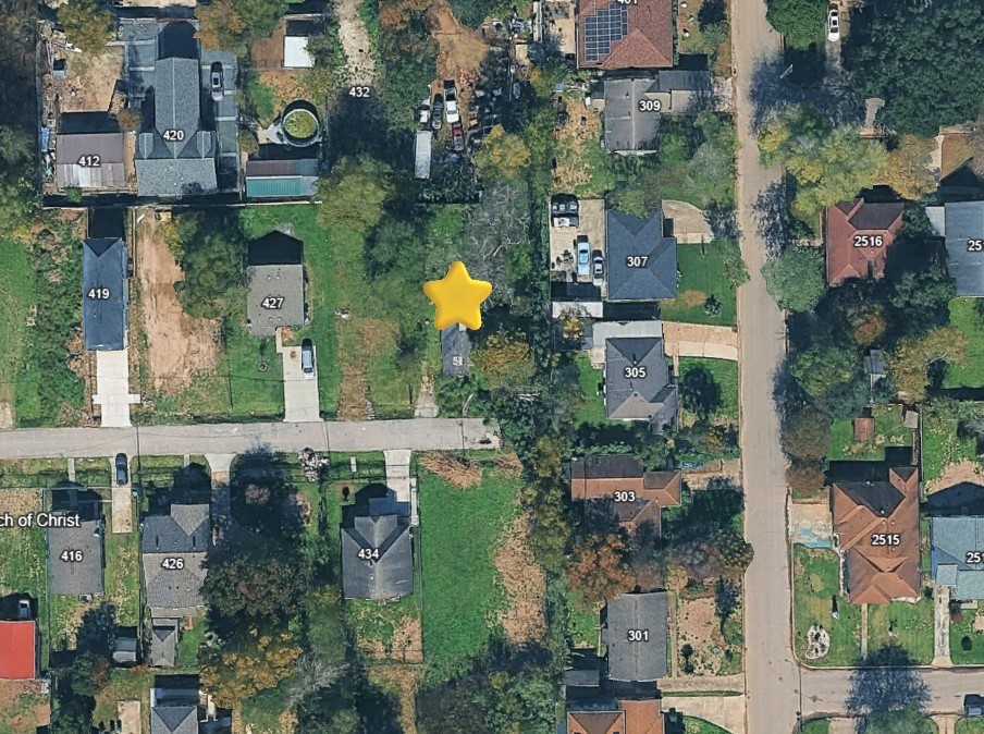 an aerial view of a houses with outdoor space