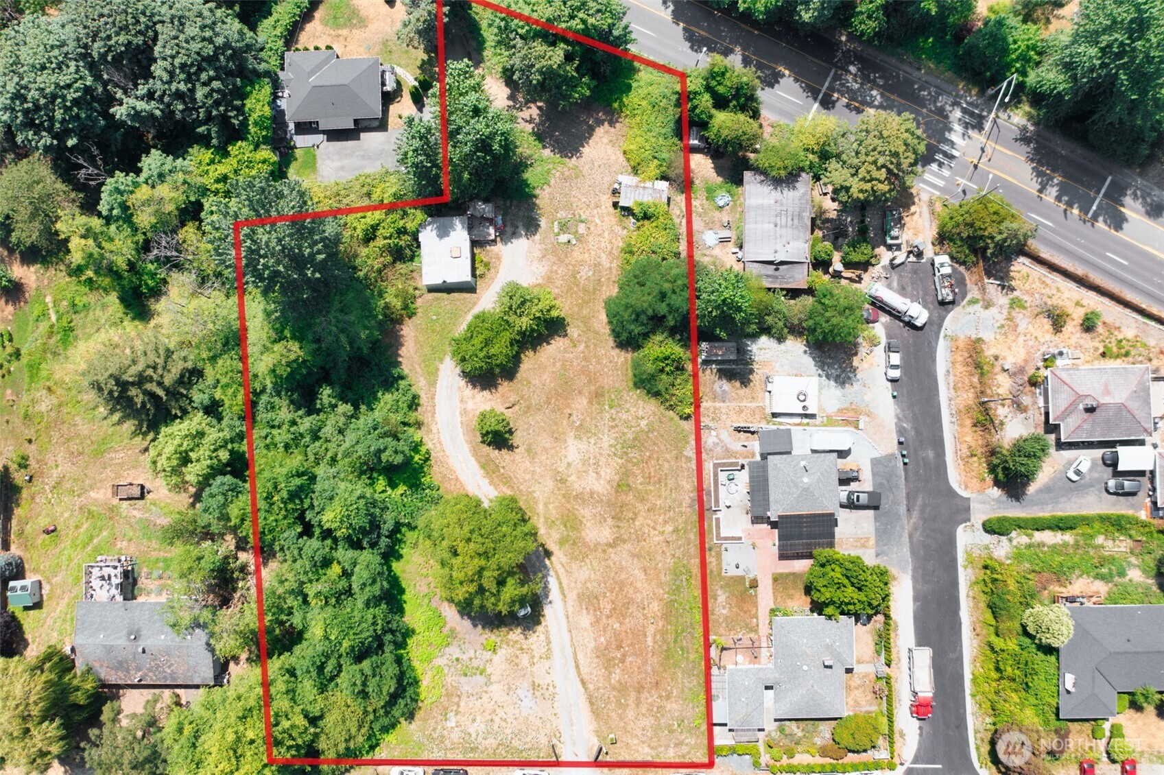 8011 South 128th Street Seattle, WA 98178 - Photo 13 of 15 an aerial view of a house with a yard and garden