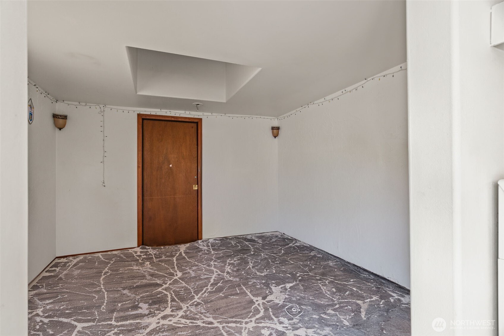 8011 South 128th Street Seattle, WA 98178 - Photo 5 of 15 a view of a room with a wooden closet