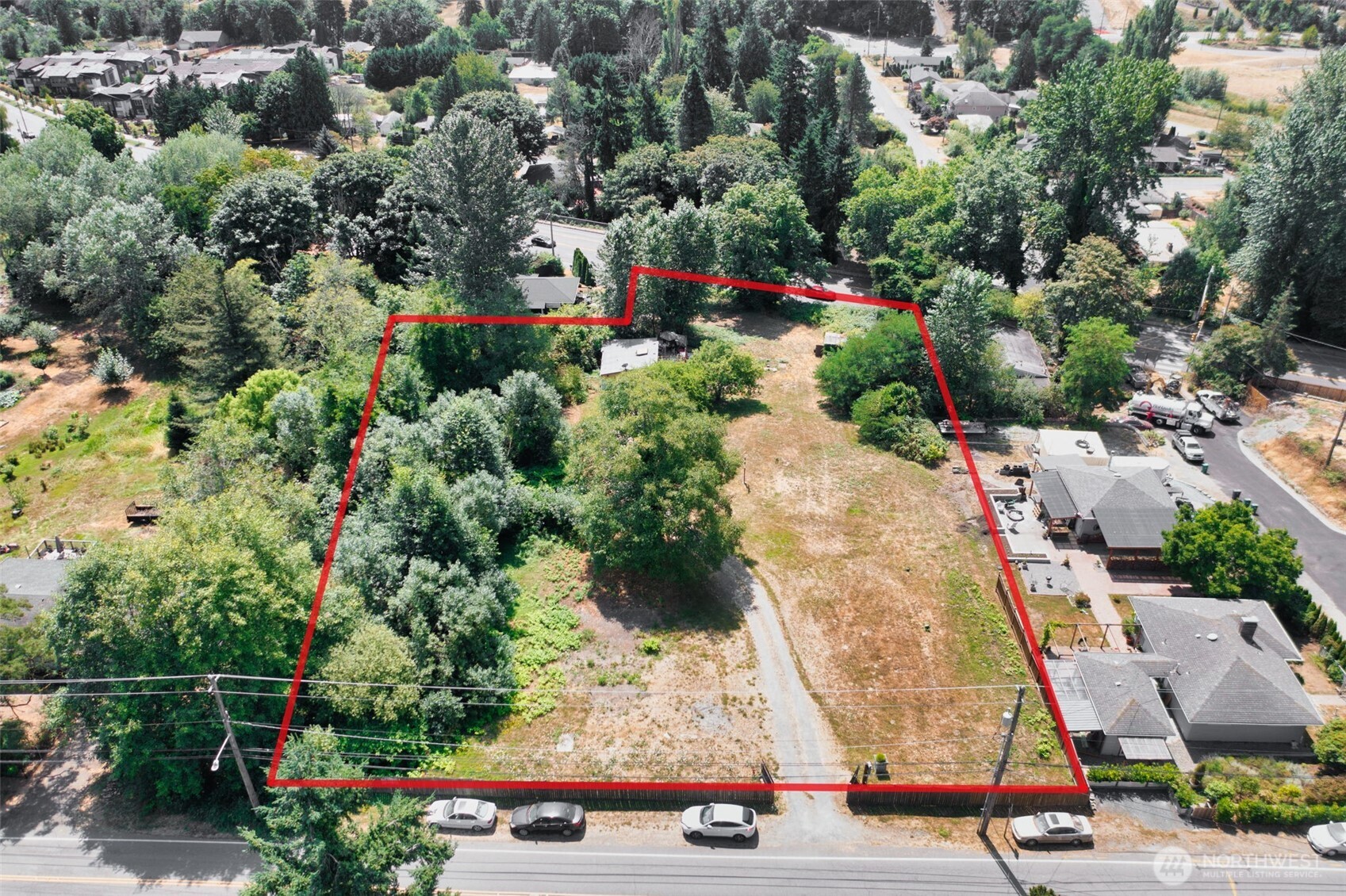 8011 South 128th Street Seattle, WA 98178 - Photo 9 of 15 an aerial view of residential houses with outdoor space
