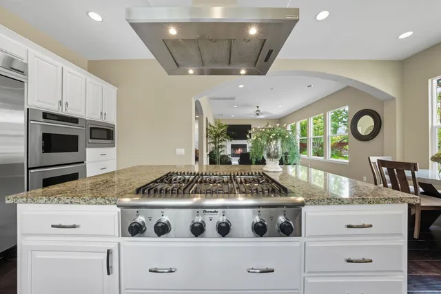 a kitchen with a stove and a microwave