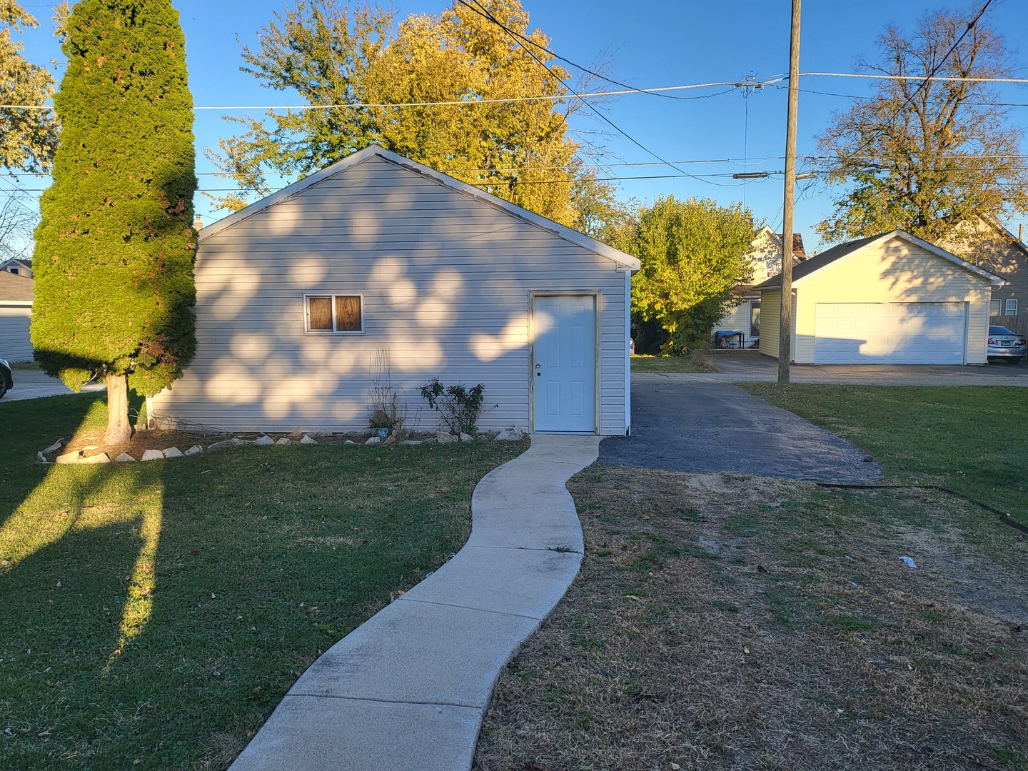 1204 North Center Street Joliet, IL 60435 - Photo 11 of 13 a view of a yard in front of a house with a yard