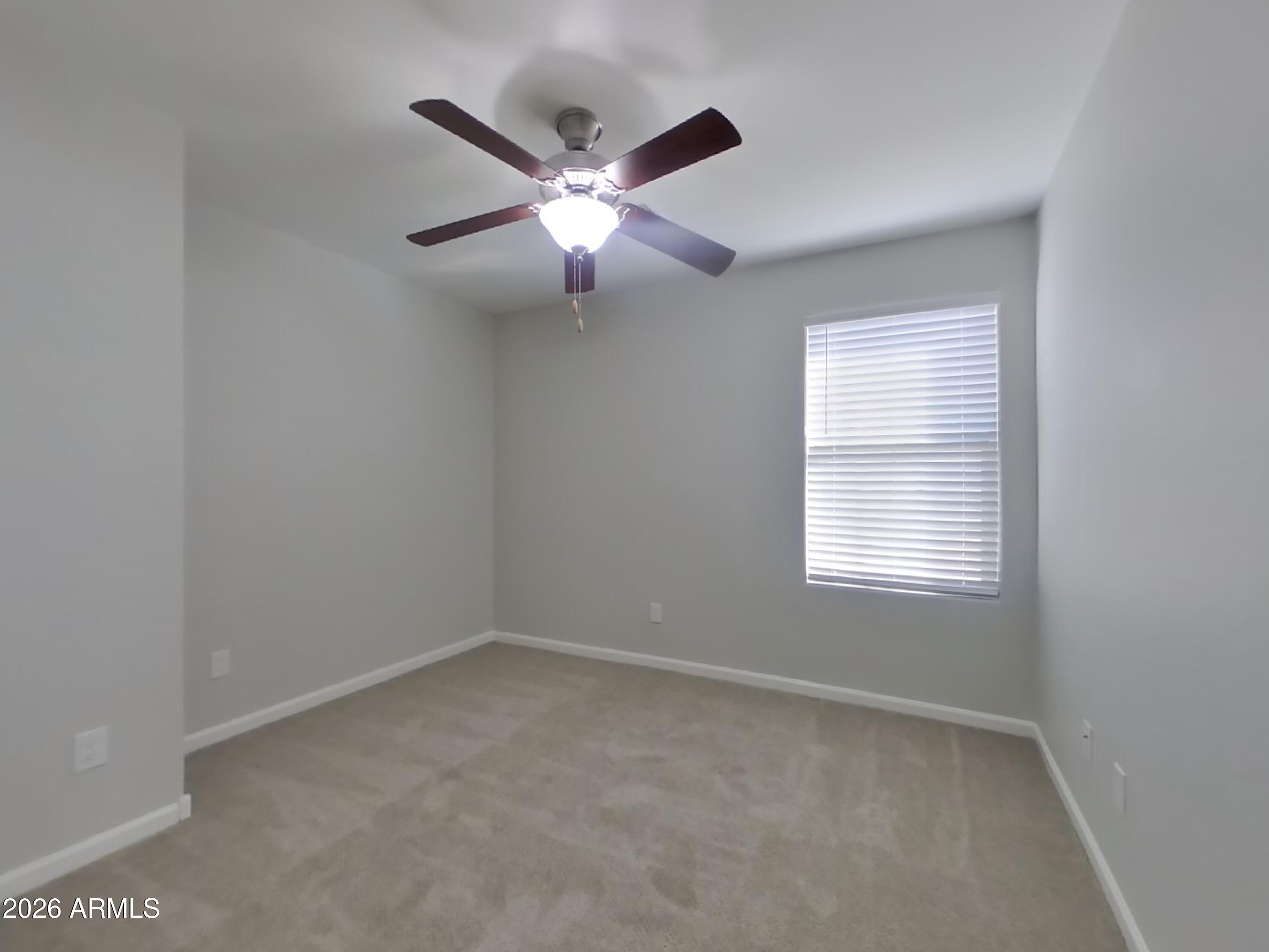 12577 West Steed Ridge Peoria, AZ 85383 - Photo 14 of 17 a view of an empty room with a window