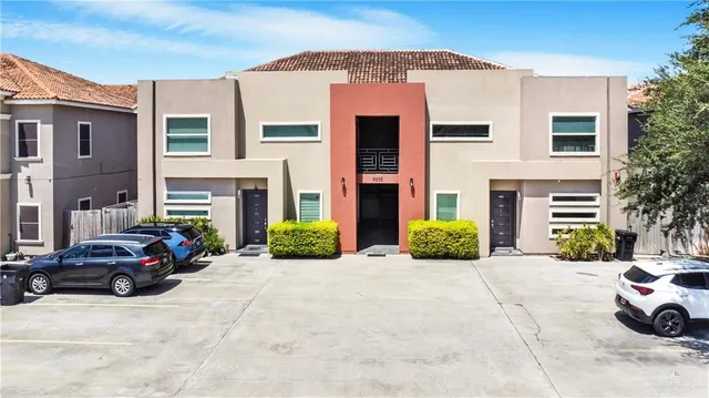 a front view of a house with parking space