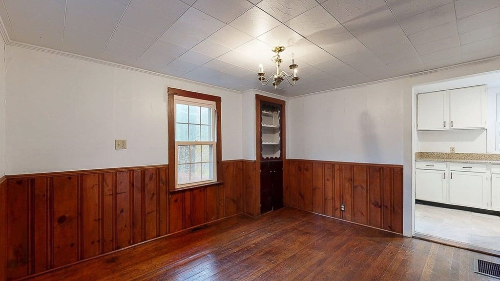 450 Mt Wayte Avenue Framingham, MA 01702 - Photo 11 of 28 an empty room with wooden floor and window