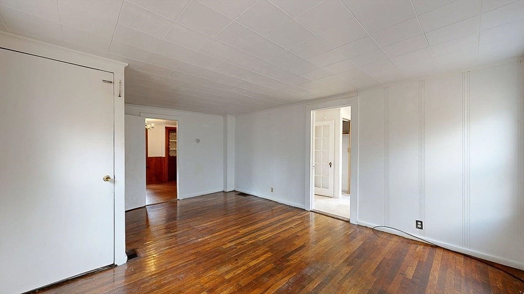 450 Mt Wayte Avenue Framingham, MA 01702 - Photo 12 of 28 a view of an empty room with wooden floor and closet