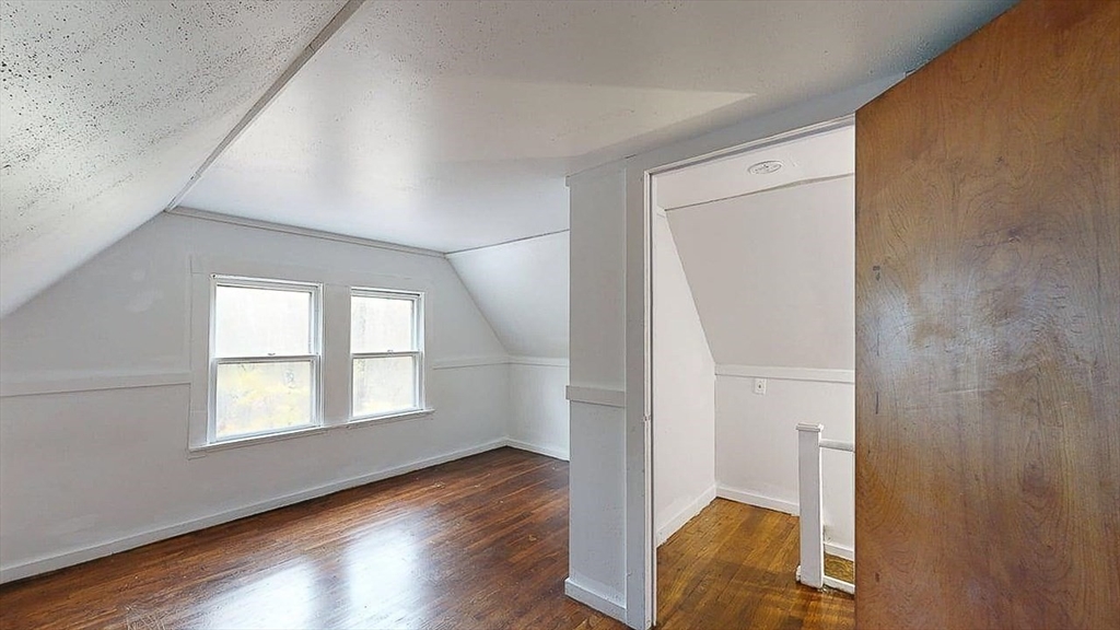 450 Mt Wayte Avenue Framingham, MA 01702 - Photo 22 of 28 wooden floor in an empty room with a window