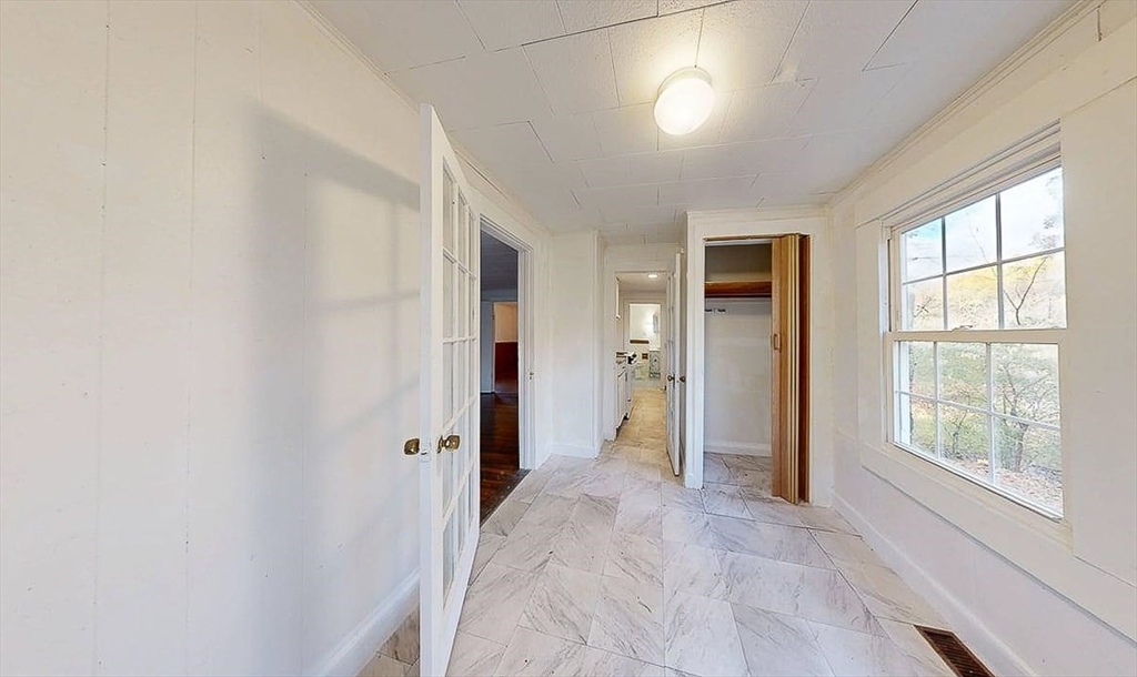 450 Mt Wayte Avenue Framingham, MA 01702 - Photo 7 of 28 an empty room with windows and closet