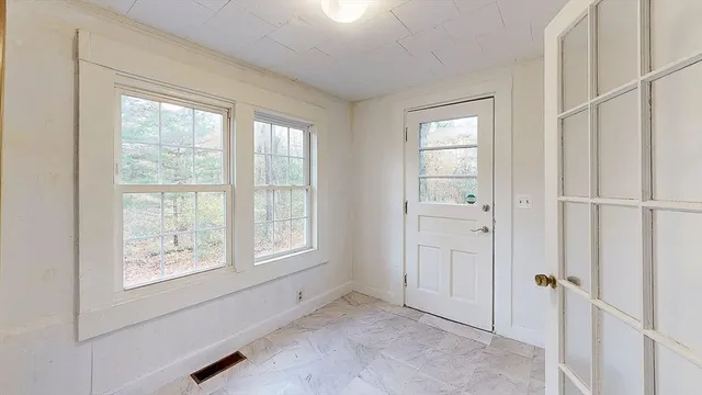 a view of an empty room with a window