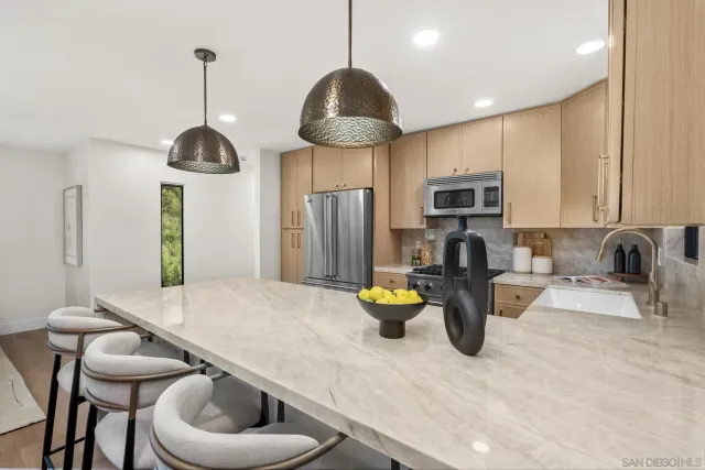 a kitchen with a table and chairs