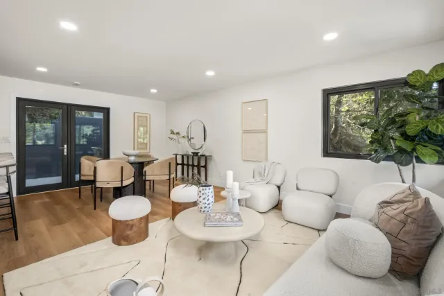 a living room with furniture and a table