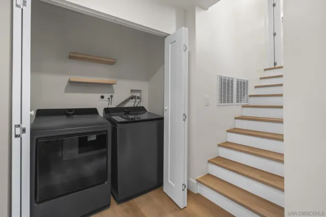 a utility room with washer and dryer