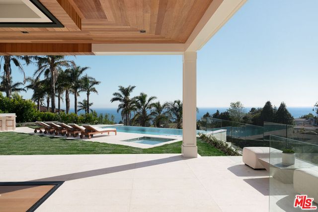 a view of a backyard door and lake view