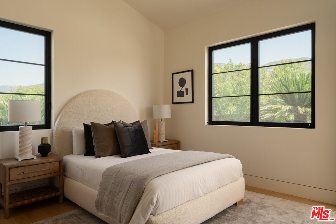 5819 Filaree Heights Road Malibu, CA 90265 - Photo 33 of 41 a bedroom with a bed and a window