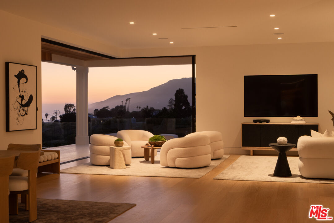 5819 Filaree Heights Road Malibu, CA 90265 - Photo 36 of 41 a bedroom with furniture and a flat screen tv