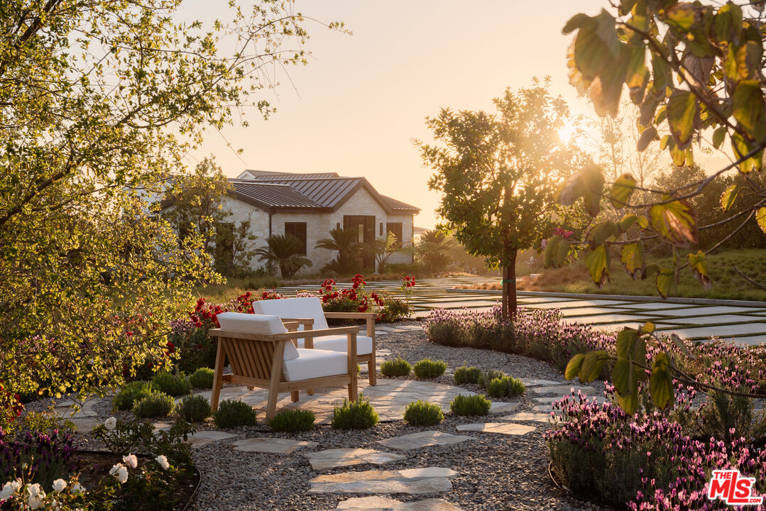 5819 Filaree Heights Road Malibu, CA 90265 - Photo 40 of 41 a front view of a house with a garden and lake view